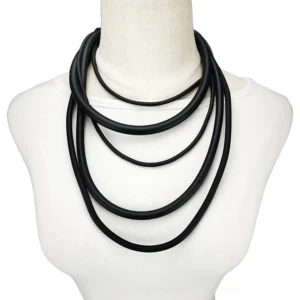 Black rubber layered gothic torque necklace displayed on mannequin showing multi-layer rope design