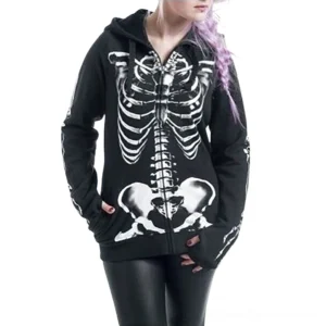 Women's skeleton zip-up gothic hoodie in black fleece with white skeleton chest print, worn by model with purple braided hair, front partial view