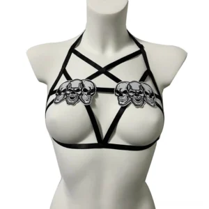 Black cupless skull chest harness front view - gothic women's elastic body garter with dual skull appliqués and pentagram crisscross straps