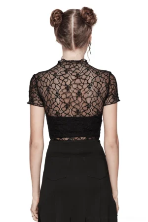 Sheer black skull lace punk top back view on model, paired with black skirt, showing cropped hemline and mesh transparency