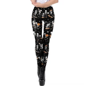 Black skull print gothic leggings with dancing skeleton pattern, front view on model with studded platform boots
