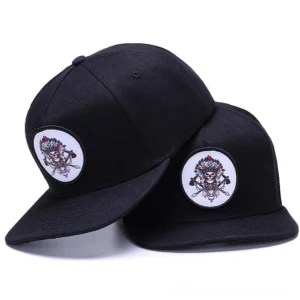 Black skull embroidered snapback gothic baseball cap with adjustable closure - oblique front view