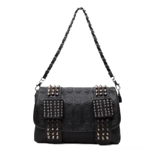 Black studded skull leather shoulder bag hanging display showing embossed details and metal hardware
