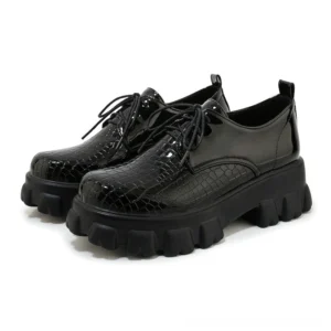 Black snake-texture patent leather lace-up platform pump, front three-quarter view, showing round toe and 6cm square heel on white background