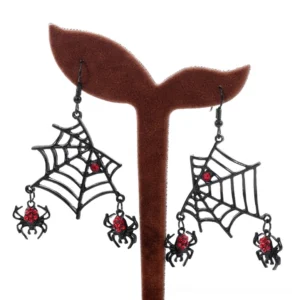 Spider web gothic dangle earrings front view, black metal with crimson crystal accents display