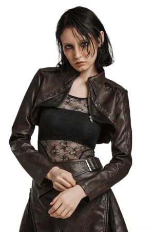 Black spike shoulder cropped gothic faux leather jacket front view on female model, white studio background