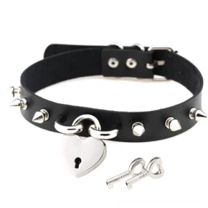 Black PU leather spike choker with silver heart lock pendant and matching key, gothic necklace flat lay