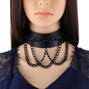 Black spiked layered chain gothic choker worn on mannequin, showcasing front close-up view with matte black cone studs and triple hanging chains
