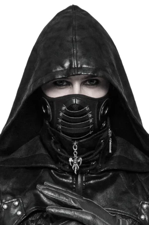 Black steampunk leather face mask with riveted metal grille front, worn by model in gothic attire, studio frontal close-up view