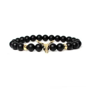 Matte black stone beaded bracelet with gold bull head charm alternative jewelry detail