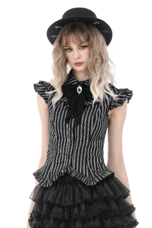 Black and white striped gothic blouse with ruffled cap sleeves and gem-adorned bow brooch, front full-body view on model