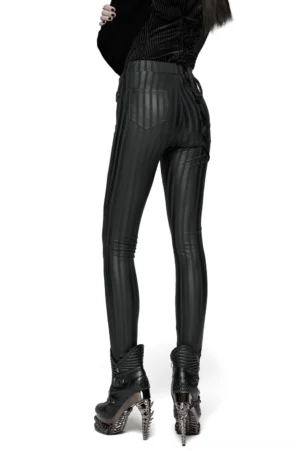 Black striped gothic leggings back view on model, showing dual rear patch pockets and slim fit with dark boots