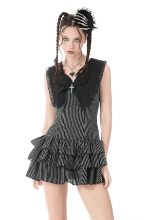 Black striped gothic ruffle dress with bow front full view on model with braided hair, pinstriped fabric with tiered ruffles and sailor collar