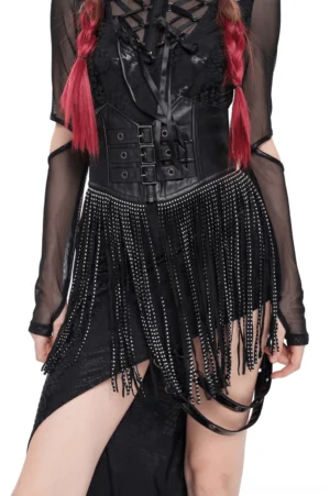 Black studded fringe corset belt with triple buckle front, worn by model with red braids, front three-quarter view showing gothic alternative fashion styling