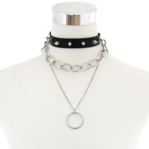 Black studded leather gothic choker necklace with dual silver chain layers and circular pendant, front flat lay view
