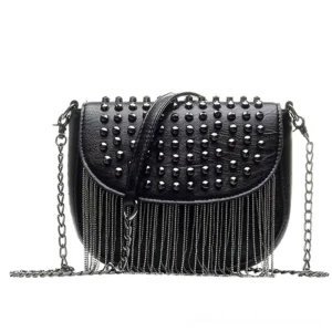 Black gothic studded crossbody bag with chain tassel, angled front view displaying studded flap and dual leather handles