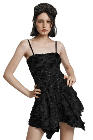 Black tattered gothic mini slip dress front three-quarter view on model, showing metal eyelet fastening and asymmetric handkerchief hem