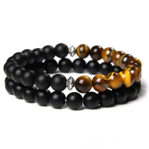 Black onyx and tiger eye stone gothic bracelet featuring dual-layer beaded design with silver metal fasteners, natural stone alternative jewelry