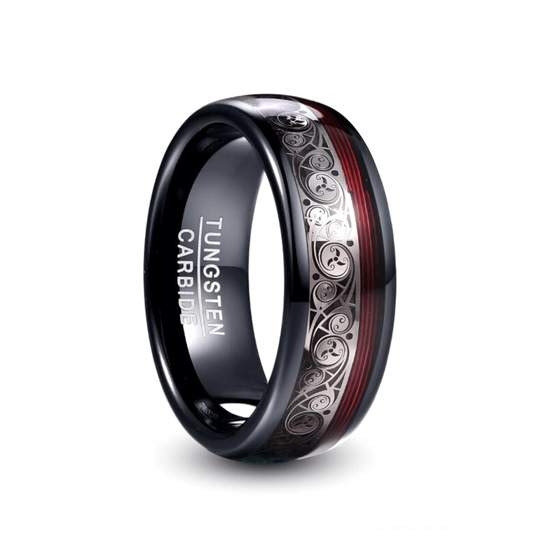 Black tungsten carbide gothic ring with ethnic inlay pattern and red accent stripe, front oblique view showing inner engraving detail