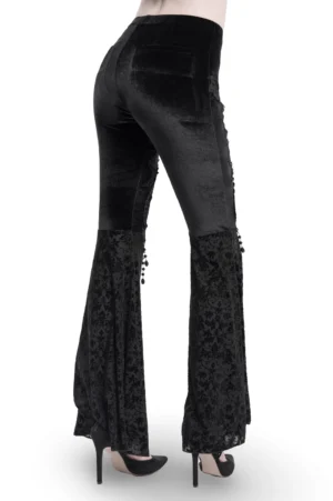 Black velvet flare pants with embroidered lace hem and mesh details - back full-body view on model
