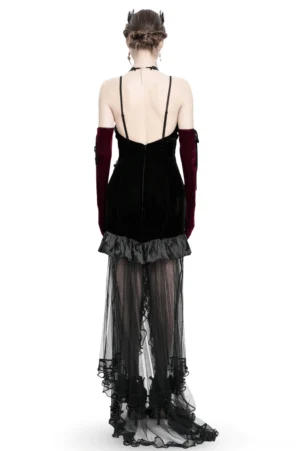 Gothic black velvet dress back view showing spaghetti straps and beaded mesh train on model