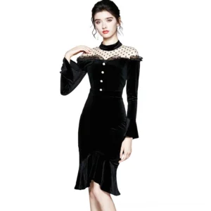 Black velvet gothic midi dress front view with polka-dot mesh yoke and pearl buttons, modeled on female fashion figure against white studio background