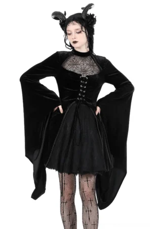 Black velvet lace-up gothic dress front three-quarter view with spiderweb lace bust panel and dramatic bell sleeves worn on model
