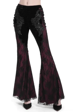 Black velvet and wine-red lace gothic flare pants front three-quarter view, showing embroidered appliqué details and dramatic lace hem