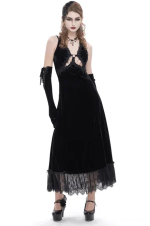 Black velvet gothic halter dress with lace hem, front view on model, showing cutout neckline and floor-length silhouette