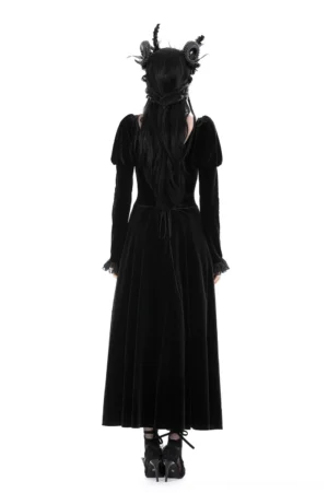 Back view of black gothic velvet dress showing corset lace-up back, long trailing velvet train, and ruffled lace wrist cuffs