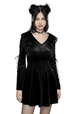 Black velvet gothic lace-up mini dress with embroidered heart collar, front full-body view on model with flared sleeves and lace-up arm details