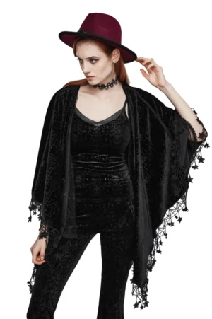 Black velvet occult pentagram cape with star tassel hem worn by female model in front three-quarter view