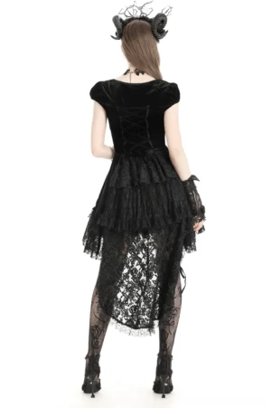Gothic swallowtail dress back view showing lace-up corset detailing, tiered ruffled lace skirt, and dramatic tail hem on model wearing gothic horn headdress