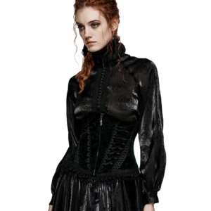 Front three-quarter view of black velveteen gothic corset with lace-up back worn over sheer floral blouse, showcasing fitted waist and elegant neckline detail
