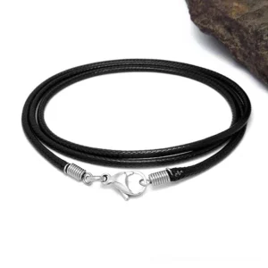 Flat lay overhead view of black wax rope necklace with stainless steel lobster clasp and spring loop guard on white background
