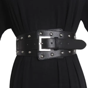 Black studded wide leather corset belt for women with silver square buckle and metal rivets, displayed on dress form