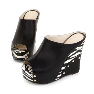 Black gothic zebra print wedge sandals with gold rivets and peep-toe design, featuring alternative fashion style
