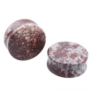 Natural bloodstone ear gauges with deep red and grey marbled pattern, showing multiple sizes from 6mm to 25mm diameter, polished stone flesh tunnels for ear stretching