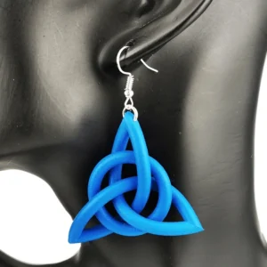Deep blue Celtic trinity knot drop earrings on black mannequin ear, detailed close-up highlighting the classic interlocking trinity knot shape in solid rubber