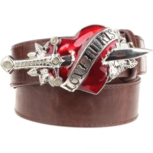 Brown gothic leather belt with metal heart pierced by dagger buckle, alternative fashion accessory front flat lay