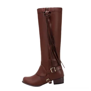 Brown gothic knee boots with decorative metal buckles and flowing tassel details, matte leather finish
