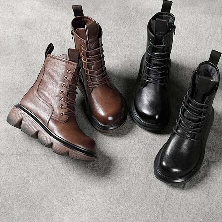 Brown gothic platform combat boots showing side zipper functionality and leather craftsmanship