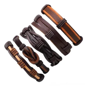 Five-piece brown leather gothic bracelet set flat lay display showing braided rope details and varied strap textures in warm earth tones