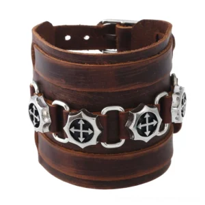 Brown wide leather gothic cross bracelet with silver zinc alloy charms, front overhead view on white background
