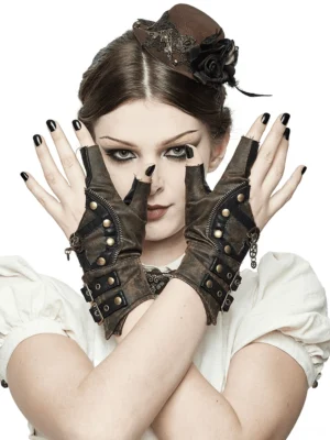 Brown fingerless steampunk leather gloves with antique rivets worn by model with gothic makeup in studio setting