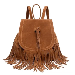 Tan brown suede tassel backpack featuring long cascading fringe and drawstring tassel detail, front view bohemian gothic style