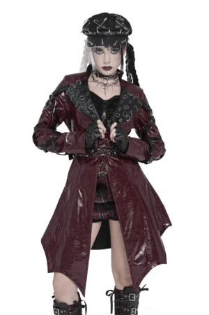 Women's burgundy patent leather gothic harness long coat with buckle panels and grommet lapels, front full-body view on model