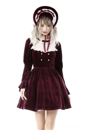 Burgundy gothic velvet dress with white lace collar and red neck tie, front three-quarter view on model