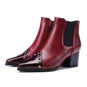 Burgundy wine red studded ankle boots with patent leather toe cap and chunky block heel, front-side studio shot