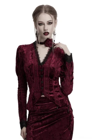 Burgundy velvet gothic blouse with dramatic gigot sleeves, black lace trim neckline, and rose buckle accents worn by model against white background - front upper body view